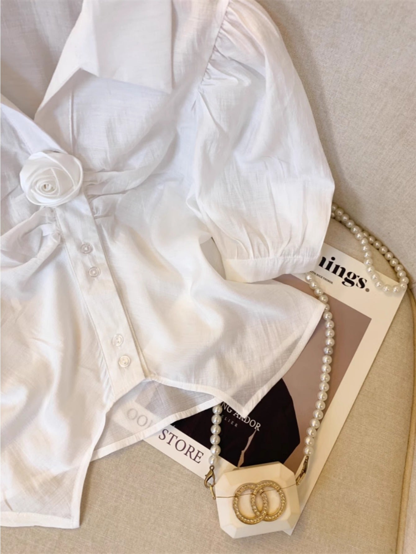 White lapel bubble sleeve shirt women's summer French three-dimensional rose splicing shirt unique split-ended sweet and spicy top