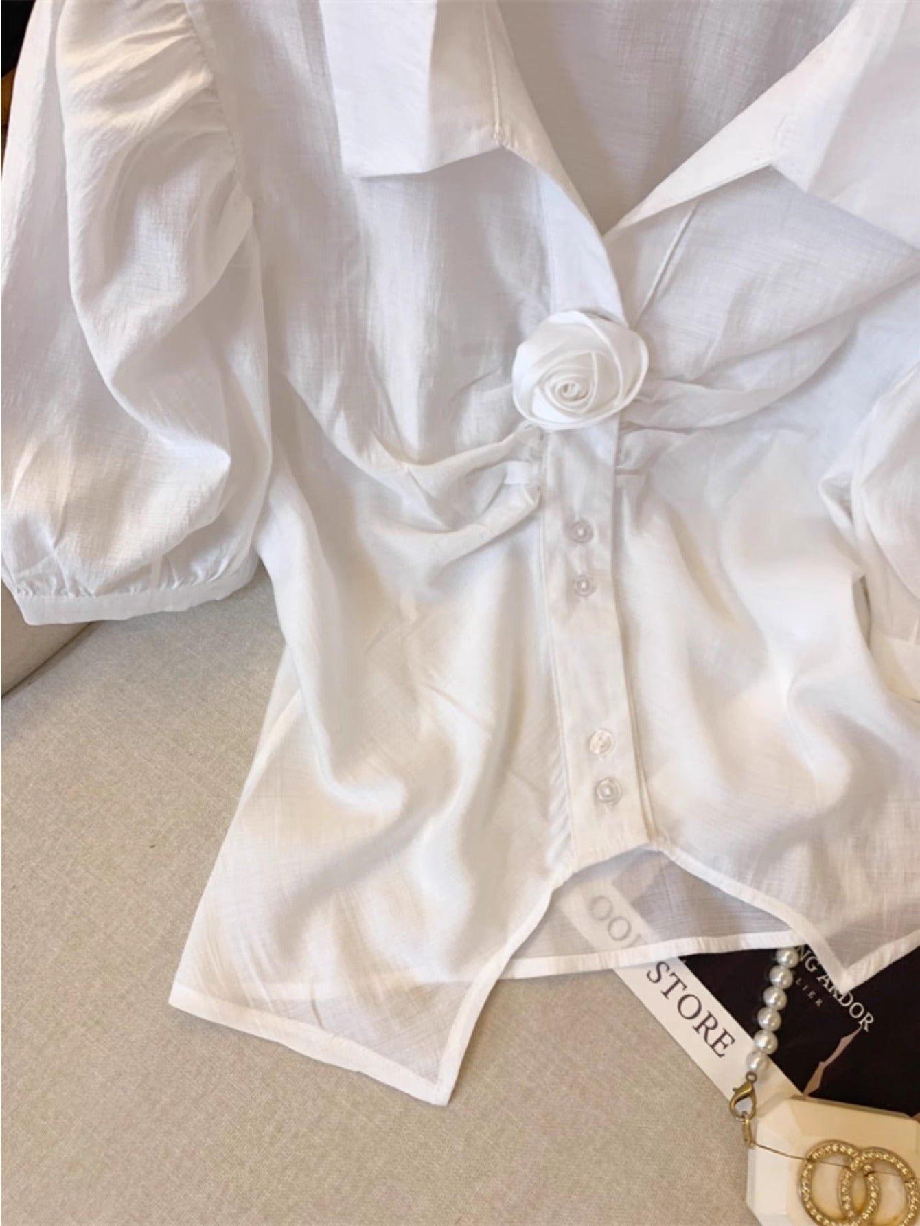 White lapel bubble sleeve shirt women's summer French three-dimensional rose splicing shirt unique split-ended sweet and spicy top